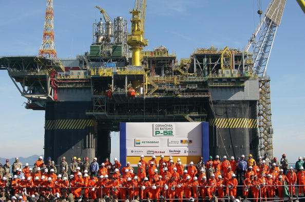 (file) petrobras workers pose in front o